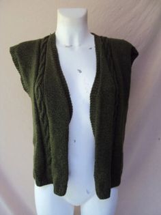 Handmade olive green knitted vest size 12, bust 92cm/36", waist 73cm/29", hip 98cm/38.5". Such a sweet little boho handmade olive green knitted vest. Olive green vest, vintage green vest, green vest, boho green vest, retro green vest, hippie green vest Green V-neck Vest For Winter, Fitted Green Vest For Fall, Green Knitted Winter Vest, Green Knitted Sleeveless Sweater Vest, Green Knit Vest For Fall, Fitted Green Sweater Vest For Fall, Vintage Green Vest For Fall, Green Vintage Vest For Fall, Olive Green Vest