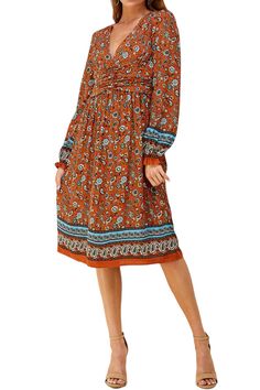 The Bohemian Printed Midi Dress from Iconic Luxe combines artistic flair, comfort, and practicality. Its unique design elements and Bohemian-inspired prints make it a standout choice for expressing your individual style. This dress is versatile and can be dressed up or down. It's suitable for casual outings, daytime events, or even dressed up for special occasions, depending on your styling choices. To complete your look, consider adding accessories such as delicate necklaces, oversized sunglasses, a wide-brimmed hat, and comfortable sandals . You can also experiment with a fringed bag and ankle boots. 100% Rayon Imported Zipper closure Hand Wash Only Features: deep V-neckline, long sleeves with elastic and ruffles details, front shirring, midi length, back zipper, paisley print Suit for: Barbeque Party, Delicate Necklaces, Brimmed Hat, Bohemian Print, The Bohemian, Oversized Sunglasses, Comfortable Sandals, Wide Brimmed Hats, Printed Midi Dress