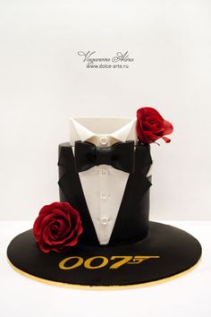 a black hat with red roses on it and a white shirt that says 007