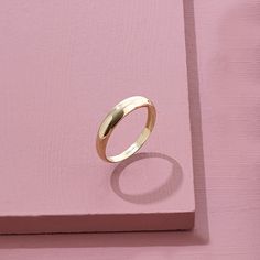 The Minimalist Dome Ring has an elegant design that its plainness is the modesty which will fascinate people around you. It is perfect for everyday use and ring stacking. - Made in 14k Solid Gold - Top Width: 4.10 mm / 0.16 inches - Thickness: 0.86 mm / 0.03 inches- Bottom Width: 2.53 mm / 0.09 inches - This product comes with iconic Norm Jewels gift box Gold Chunky Ring, Wedding Band Simple, Thick Gold Band, Solid Gold Wedding Band, Bubble Ring, Luxury Jewelry Brands, Chunky Ring, Solid Gold Band, Dome Ring