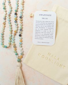 This Mala Beads Necklace is hand-knotted with Amazonite crystals and features 14K Gold-filled accent beads and a handmade cotton tassel. Hand-knotted traditional style This piece has the traditional 108 beads Spiritual Tassel Necklace With 108 Round Beads, Adjustable Spiritual Tassel Necklace With Natural Stones, Adjustable Tassel Necklace With Natural Stones For Gift, Bohemian Mala With 8mm Beads For Blessing, Holistic Hand Knotted Round Bead Jewelry, Bohemian Hand Knotted Mala For Meditation, Bohemian 108 Beads Mala For Blessing, Bohemian Necklaces With 8mm Beads For Rituals, Bohemian Mala With 108 Beads For Blessing