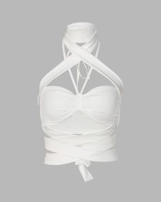 Details: Crop halter top with bandage style wrapping designLength: CroppedSleeve Length: SleevelessMaterials: 95% Cotton + 5% Spandex Stretch Sleeveless Cross-tied Halter Top, White Halter Neck Crop Top With Straps, Summer Stretch Bandage Halter Top, White Stretch Halter Top With Straps, Fitted Summer Halter Top With Bandage Detail, Fitted Bandage Halter Top For Summer, Stretch Crisscross Cross-tied Halter Top, Stretch Cross-tied Crisscross Halter Top, White Backless Halter Top With Straps