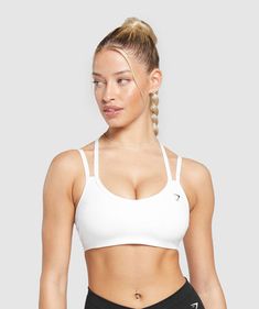 IT’S NOT YOU, IT’S YOUR SPORTS BRA With lightweight, breathable designs, comfortable cups and supportive straps, you can rely on our sports bras to be there for you, and for yours. • Cute double strap feature• Removable padding lets you to wear it how you want• Light V-neck• Stay-put elasticated underband SIZE & FIT• Medium support• Body fit• Model is 5’8” and wears a size XS MATERIALS & CARE• 78% Recycled Polyester, 22% Elastane SKU: B8A6A-WB57 Sporty Racerback Sports Bra With Straps, Sporty Sports Bra With Straps For Gym, Sporty Sports Bra For Gym, Racerback Sports Bra With Adjustable Straps For Light Sports, Sports Bra With Straps In White, Sporty Racerback Sports Bra With Adjustable Straps, Sporty Sports Bra With Adjustable Straps And Medium Support, White Gym Activewear With Straps, White Strappy Gym Activewear