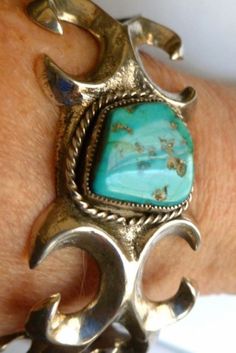 -Turquoise -Sterling Silver Braclet - Sand Cast Silver -Navajo Pawn Jewelry -Native American --50 grams -- Cuff  Bracelet -I bought this Pawn bracelet at a Navajo Pawn shop about 15 miles from Gallup, New Mexico. It is a Navajo sand casting in sterling silver. The bracelet weighs 50 grams and has a beautiful bright blue turquoise cabochon, with matrix .  Navajo  prefer turquoise with matrix. The turquoise is bezel set with twisted silver wire around the bezel. The outside of the bracelet measures 6 1/2 inches, the inside is  5 1/2 inches AND YOU CAN ADJUST IT TO YOUR WRIST.                                                        SALE--MARKED DOWN FROM $390 TO $339   AND FREE SHIPPING Bohemian Turquoise Sterling Silver Bracelet, Southwestern Untreated Bracelet Jewelry, Southwestern Style Natural Bracelet, Bohemian Adjustable Untreated Bracelets, Gallup New Mexico, Tufa Casting, Turquoise Bracelets, Vintage Native American Jewelry, Silver Turquoise Jewelry