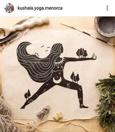 an image of a woman doing yoga on a piece of paper next to yarn and scissors