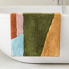 a bathroom rug with different colors on it