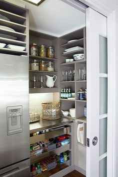 an open pantry with lots of items in it