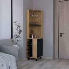 a room with a bed and a wine cabinet in it