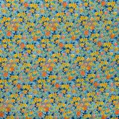 a blue and orange flowered background with many small flowers on the bottom half of it