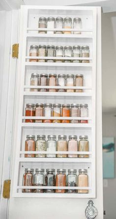 an organized spice rack in a kitchen