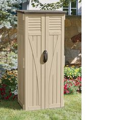 an outdoor storage shed in the grass