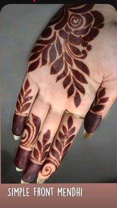 a woman's hand with henna tattoos on it and the words simple front mehn