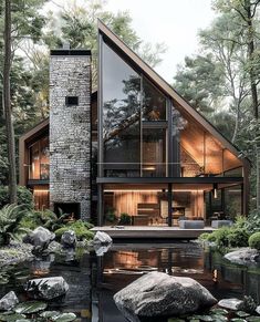 a house that is surrounded by water and rocks in the middle of a forest with lily pads on the ground