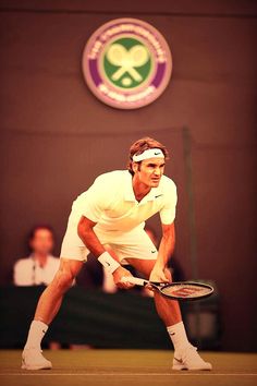 a man standing on a tennis court holding a racquet