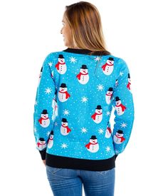 Frosty the Snowman may be cool, but have you heard of Snazzy the Snowman? At least, we like to hope that's what this dude is called. Our Women's Snazzy Snowman cardigan features our favorite Christmas characters bopping around your torso on a sky blue background. It's the perfect chilly nod to the festive season we need, without having to dress head to toe in red and green. Got a last-minute office party? Throw it on for that instant Christmas angel effect. Dress it up for all-nighters or take i Sky Blue Background, Tipsy Elves, Christmas Outfits Women, Frosty The Snowmen, A Sky, Chic Christmas, Christmas Outfits, Christmas Characters, Christmas Women