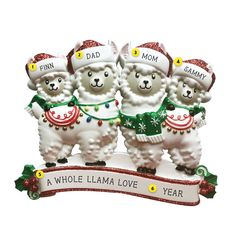 three white llamas wearing christmas hats and sweaters on top of a banner