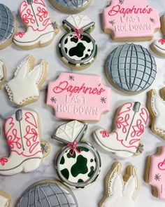 decorated cookies are displayed on a table