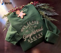 Introducing our Santa Claus Gingerbread Bakery Embroidered Crewneck Sweatshirt, the perfect gift for men and women. Made with high-quality materials, Gingerbread Bakery, Mrs Santa Claus, Hawaiian Shirt Women, Embroidered Crewneck, Christmas Couple, Sweatshirt For Men, Long Sleeve Sweatshirt, Embroidered Tshirt, Cozy Sweatshirts