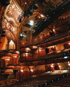 an auditorium filled with lots of seats and lights