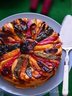 a plate with a pastry on it and a fork next to it