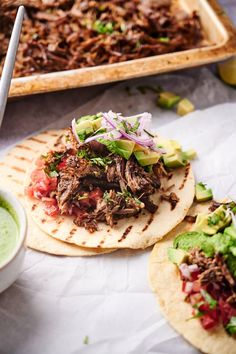 pulled pork tacos with avocado and salsa