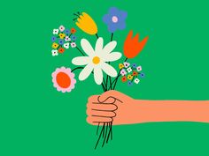 a hand holding a bouquet of flowers on a green background