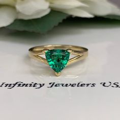 This ring is a trillion lab created green emerald made in solid 14k yellow gold item #5843 Ring has split shank design and 3 prong setting. Emerald is the birthstone for May Gem Type: lab created emerald -Shape: Trillion / 7x7MM -Weight: 1.00ct (approx.) diamond equivalent -Stone Color: Lively Medium Green, Eye-clean / The Best Color in Emeralds -Hardness: 8.5 Moh's Scale Mounting: -Metal Type and Purity: 14k yellow gold -Setting: 3 prong split shank design -Listed Ring Size: 6.5 -Country of Man Triangle Ring, Green Eye, Lab Created Emerald, Best Color, Yellow Gold Setting, Emerald Engagement, Split Shank, Emerald Engagement Ring, Green Emerald