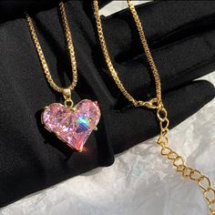 This Stunning Pink Sapphire Heart Pendant Necklace Is The Perfect Blend Of Elegance And Charm. The Heart-Shaped Crystal Sparkles With Rainbow Reflections, Beautifully Set In A Gold-Plated Chain For A Luxurious Look. The Adjustable Chain Allows For A Customized Fit, Making It A Versatile Piece For Any Occasion, Whether Casual Or Formal. Condition: Brand New, Never Worn. Details: - Gold-Plated Chain - Pink Lab Sapphire Heart Pendant - Adjustable Chain For A Perfect Fit - Eye-Catching And Glamorous Heart Cut Charm Jewelry For Party, Heart Cut Jewelry With Heart Charm For Party, Party Jewelry With Heart Cut Charm, Valentine's Day Pink Gold Plated Jewelry, Rose Gold Heart Pendant Jewelry For Party, Gold Heart Necklace For Mother's Day Party, Pink Heart Pendant Jewelry For Party, Pink Heart Beads Jewelry For Party, Pink Heart Beads Necklace For Anniversary