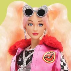 a barbie doll wearing sunglasses and a pink outfit with red fur on it's head