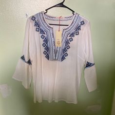 Never Worn!, Solitaire Brand, Sz M Pure-White Slipover Boho Blouse, 100 Percent Cotton, With A V-Neck, A Lite-And-Deep-Blue Embroidered Triangles And Squares Pattern, And 3/4-Length Sleeves With Big Bells. Wash Cold Separately, Very Gentle. Hang To Dry. White Casual Top With Embroidered Neckline, Casual White Top With Embroidered Neckline, Casual White Tops With Embroidered Neckline, White Casual Tunic With Floral Embroidery, White Embroidered Tunic Top, Casual Embroidered White Tunic, Casual White Embroidered Tunic, White Long Sleeve Blouse With Embroidered Hem, White Tops With Embroidered Hem For Beach