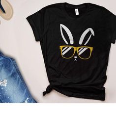 Easter T Shirt for Adults or Kids | Rabbit face shirt with bunny in sunglasses, cool Easter tshirt, Black T-shirt With Cartoon Print For Spring, Black Cartoon Print T-shirt For Spring, Spring Black T-shirt With Cartoon Print, Casual Bunny Design T-shirt For Spring, Spring Casual T-shirt With Bunny Design, Casual Short Sleeve T-shirt For Easter, Black Funny T-shirt For Summer, Funny Black Summer T-shirt, Funny Black T-shirt For Summer