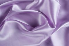 INFORMATION: This beautiful Stretch Charmeuse Sayin Fabric has a beautiful smooth shiny satin side with a modest matte finish on the back. The fabric is tightly woven and has a light 2-way vertical stretch, making it extremely durable. In addition, our stretch charmeuse is approximately 7 ounces per linear yard which is a better construction than most standard stretch charmeuse fabrics. This heavier gsm (grams per square meter) gives the fabric a richer feeling and a better hold when draping. Th Light Purple Dress, Feed Goals, Lavender Silk, Purple Silk, Luxury Silk, Silk Charmeuse, Stretch Satin, Flannel Fabric, Matching Dresses