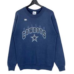 Vintage 90's NFL Dallas Cowboy Crewneck Sweatshirt Blue Greyish Size Medium Made in USA  * Size on Tag : 18/20 * Manual Measurement (inch) : Chest (armpit to armpit) 21, Length 27.5, Shoulder 21, Sleeve 23.5, Hem 16. * Recommended for Size : Medium (M) * Color : Blue Greyish * Condition : USED CONDITION with FADED & 1 PINHOLE (please see all photos). SW112 Dallas Cowboys Vintage Crewneck, Cowboy Crewneck, Dallas Cowboys Sweatshirt, Dance Camp, Dallas Cowboy, Nfl Dallas Cowboys, Vintage Crewneck, Dallas Cowboys, Mens Sweatshirts