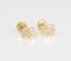 This Cute and Precious dainty Elephant Stud Post Earrings are made from high quality Solid 14k Gold They are a perfect gift for anyone of any age and excellent for everyday wear. Item Specifications: Model # BE-410S7 Metal Type: Solid 14K Gold Metal Stamp: 14K Shape Baby Elephant Fastening: Screw Back Style: Stud Post Size: SMALL Size: 4 x 7mm ( 3/16 x 5/16 inch ) Earrings Puff Pad size: 1 3/8 inches x 1 1/8inch (35mm x 28mm) The screw backs are really good for kids and adults because its hard t Gold Screw Back Diamond Earrings For Gift, Gold Diamond Screw Back Earrings For Gift, Gift Gold Diamond Earrings With Screw Back, Gold Diamond Earrings With Screw Back As Gift, 14k Yellow Gold Earrings With Screw Back, 14k Yellow Gold Screw Back Earrings, Elephant Earrings Studs, Elephant Shape, Tiny Elephant