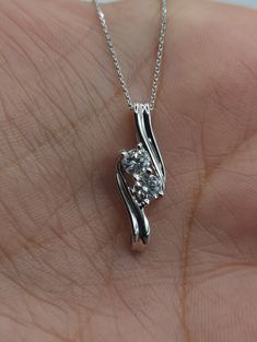 "This is a beautiful Lab Grown diamond design pendant.  It is set in real solid 14Kt Gold and the chain is 14Kt Gold as well.  You can choose if you want 14Kt White Gold, 14Kt Yellow Gold or 14Kt Rose Gold.  We have a lot of beautiful jewelry with natural diamonds. If any listing states \"diamond\" then it is a natural diamond. If the listing states \"Lab Grown\" it is a Lab Grown diamond. It has a special loop where the chain goes through so that the diamond sits comfortably on you when you wear it. This is the perfect gift for mom, wife, fiancee, girlfriend, valentine, daughter, family or friend. It is a special gift for mother's day, valentine's day, wedding, anniversary, birthday, Christmas, Easter, New Year's and any holiday. Each diamond is 0.18 Ct for a total of 0.36 Ct Color: FG Cl Diamond Solitaire Pendant, Solitaire Pendant, Perfect Gift For Mom, Diamond Design, 14kt Gold, Diamond Solitaire, Mother Day Gifts, Lab Grown, Lab Grown Diamonds