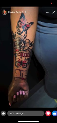 a woman's foot with tattoos on it and butterflies in the air above her