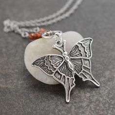 Butterfly Necklace  with faceted hessonite garnet gemstones with silver pewter ring & butterfly pendant. a perfect nature-inspired gift for a loved one, a special friend, or just for you! DETAILS  ♥  Pendant is 1.1/2 inches in length. ♥  On an 18-inch stainless steel chain. ♥  All of my pewters are lead-free. ♥  I use all-natural gemstones and freshwater pearls. SHIPMENT & DELIVERY ♥  All my items are ready to ship within 1-3 business days. ♥  Packages are typically shipped via USPS First Class Mail in 2-6 business days including tracking and delivery confirmation. KEEP SHOPPING WILDHAREGEMS Return to my main shop page here: ♥ https://www.etsy.com/shop/Wildharegems Sterling Silver Butterfly Birthstone Jewelry, Adjustable Sterling Silver Jewelry With Butterfly Charm, Silver Butterfly Jewelry With Birthstone, Handmade Spiritual Butterfly Necklace, Bohemian Butterfly Sterling Silver Necklace, Bohemian Sterling Silver Butterfly Necklace, Bohemian Butterfly Charm Necklace As A Gift, Bohemian Butterfly Necklace With Charm As Gift, Bohemian Butterfly Charm Necklace For Gift