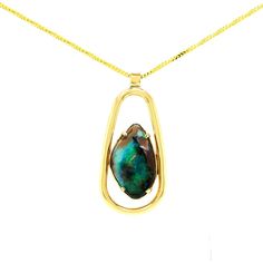 "This beautiful boulder Opal is framed by 14 karats of yellow gold. This will make the perfect gift for October's baby. This Necklace is from our \"Opalescence\" collection. Each stone is unique in cut and color. [MATERIALS] Stones: Opal (1) Carat: 17.75 Clarity: slight inclusions Play of color: Blue, Green, and black hues Cut: Pear Type of Opal: Boulder Origin: Queensland, Australia Clarity and Transparency: Opaque Metal: 12.20 Grams of Yellow Gold [ORDERS] All items made to order take about 7- Gold Teardrop Jewelry With Bezel Setting, Yellow Gold Teardrop Jewelry With Bezel Setting, Yellow Gold Cabochon Teardrop Pendant Necklace, Boulder Opal Necklace, Ruby Bands, Boulder Opal Pendant, Necklace Green, Monogram Necklace, Green Opal