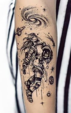 an astronaut tattoo on the arm with stars and planets in the sky behind it,