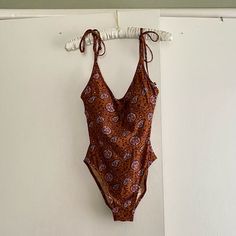 Very Cute And Subtly Sexy Madewell Swimsuit In A Whimsical Print With Dark Caramel Brown Background. Deep Scoop In The Back, Ties At The Shoulders, Removable Pads In The Mesh Shelf Bra. New With Tags But Does Not Have The “Hygienic” Strip. Never Been Worn! Size 6 Brown Beachwear Bodysuit For Vacation, Fitted Brown Bodysuit For The Beach, Brown Summer Bodysuit For Poolside, Brown Bodysuit For Poolside Summer, Fitted Brown Bodysuit For Beach Season, Fitted Brown Bodysuit For Beach, Fitted Brown Swimwear For Pool, Summer Brown Lined Bodysuit, Fitted Brown Beachy Swimwear