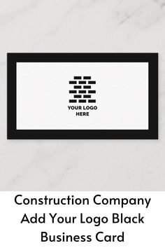 the construction company logo is displayed on a white marble background with black and white business cards