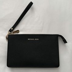 Michael Kors Daniela Black Md Wristlet Leather - New Black Clutch Wallet With Wrist Strap, Classic Everyday Clutch With Wrist Strap, Classic Clutch With Wrist Strap For Travel, Black Pouch Wristlet With Wrist Strap, Black Leather Pouch Wristlet, Black Pouch Clutch With Wrist Strap, Black Travel Wristlet With Wrist Strap, Black Wristlet With Wrist Strap For Travel, Classic Clutch Wristlet With Zipper