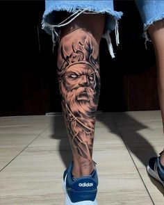 a person with a tattoo on their leg