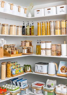 an organized pantry with lots of food items and containers on the shelve shelves