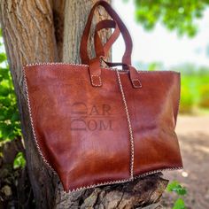 Leather Bag Handmade Bag Brown Bag ## Product Characteristics ## - Dimension :(12.40H * 16.14W* 4.13D)inch [ 31.5x41x10,5cm] -Color : Brown -Material: 100 % genuine leather -100% Handmade This bag is handcrafted from high quality goat leather. The leather we use is treated with natural materials that make the leather has no unpleasant smell. This bag is the best choice for you , because it is very comfortable and durable. ##Note ## We still need your phone number for the shipping company can you please send it! Brown Leather Artisan Hobo Bag, Hand-stitched Brown Leather Shoulder Bag, Brown Hand-stitched Leather Bag, Luxury Leather-lined Hobo Bag For Shopping, Artisan Leather-lined Tote Shoulder Bag, Leather Hobo Bags, Sweet Bags, Goat Leather, Unique Bags