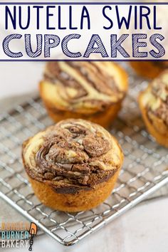 nutella swirl cupcakes on a cooling rack with text overlay that reads, nutella swirl cupcakes