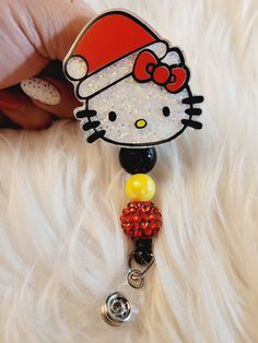 Adorable HK Santa Badge Reel. Available with beads. Beads may vary.  Message me if you have a color preference. I'd be more than happy to customize it for you. Badge reels are attached with 3M dual lock velcro and are interchangeable. If you prefer a permanent glue please send me a note when you purchase.  Care instructions: Please avoid dropping, while items are durable they are not indestructible. Please handle with care. RETURNS/EXCHANGES: Due to all items being personalized and made to order we do not accept returns or exchanges. If there are any issues with your order you must notify us within 24 hours of delivery. Thank you! CHANGE OF ADDRESS: Please Double check your address as you are checking out. We are not responsible for packages that are lost due to wrong address. Customizable Fun Badge Reel For Gifts, Fun Beaded Craft Supplies For Gifts, Adjustable Multicolor Badge Reel For Gift, Adjustable Multicolor Badge Reel For Gifts, Adjustable Fun Badge Holders For Gifts, Personalized Fun Badge Reel For Gift, Customizable Red Badge Reel As A Gift, Personalized Fun Badge Reel Gift, Handmade Multicolor Badge Holders As Gifts