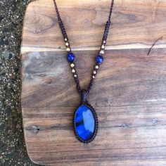 A high quality labradorite pendant with a terrific blue flash. Wrapped by band with brown macrame cord and threaded on a beaded necklace featuring lapis lazuli beads of equal glamour! Pendant height 4.1cm x 2.5cm width. I was drawn to support this piece with the lovely electric blue color in these lapis lazuli beads. It just adds an extra layer of blue, a beautiful addition as this lapis beads are a high quality and hence are a gorgeous color. Features-  - Oval shape blue flash labradorite, heig Bohemian Blue Labradorite Necklace, Adjustable Blue Labradorite Necklace, Handmade Blue Necklaces With Waxed Cord, Handmade Blue Necklace With Waxed Cord, Spiritual Blue Macrame Necklaces, Blue Spiritual Macrame Necklace, Blue Macrame Hippie Jewelry, Spiritual Blue Macrame Necklace, Blue Hippie Macrame Jewelry