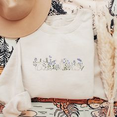 Custom Embroidered Easter Sweatshirt, Embroidered Bunny Sweatshirt, Rabbit and Flower Embroidered Shirt, Gift for Her, Easter Gift, Cottagecore embroidered Sweatshirt Experience the essence of spring in full bloom with our 'Rabbit and Flower' embroidered sweatshirt! Delicately stitched with adorable rabbits nestled among vibrant blossoms, this sweatshirt is a celebration of nature's beauty and charm. Each detail exudes elegance and whimsy, making it a perfect addition to your wardrobe for the se White Floral Embroidery Sweatshirt For Spring, White Embroidered Sweatshirt For Spring, Spring White Sweatshirt With Custom Embroidery, White Sweatshirt With Custom Embroidery For Spring, White Relaxed Fit Sweatshirt With Floral Embroidery, White Floral Embroidery Sweatshirt With Relaxed Fit, White Custom Embroidered Sweatshirt For Spring, White Floral Embroidered Sweatshirt Relaxed Fit, White Floral Embroidered Sweatshirt With Relaxed Fit