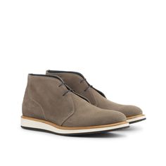 Easily identifiable by it's unique height, chukka boots have recently become a staple for men looking to dress well while still being casual. A Chukka boot adds comfort and versatility to any wardrobe. The Details: Materials: plaid sartorial + grey suede Sole: Jogging sole The Fine Print: Shoe production timeline/shipping Can vary from 30-40 days from the date of order. All shoes are handmade, small tiny changes or imperfections are natural. Color differentiation of shoes may vary, product color Business Casual Ankle Boots With Rubber Sole, Ankle Boots With Rubber Sole For Business Casual, Rubber Sole Ankle Boots For Business Casual, Casual Wingtip Boots For Business Casual, Suede Plain Toe Boots For Business Casual, Casual Business Desert Boots With Suede Lining, Modern Suede Boots With Contrast Sole, Casual Wingtip Chukka Boots For Fall, Casual Business Suede Chukka Boots